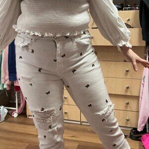 white ripped jeans with embroidered monarch butterflies!!